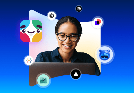 Slackbot sits atop a laptop and phone